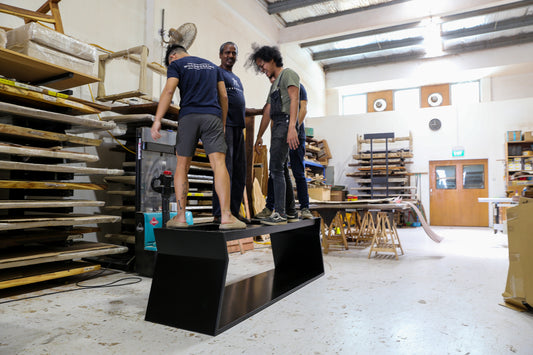 A customised dining table leg design in black steel