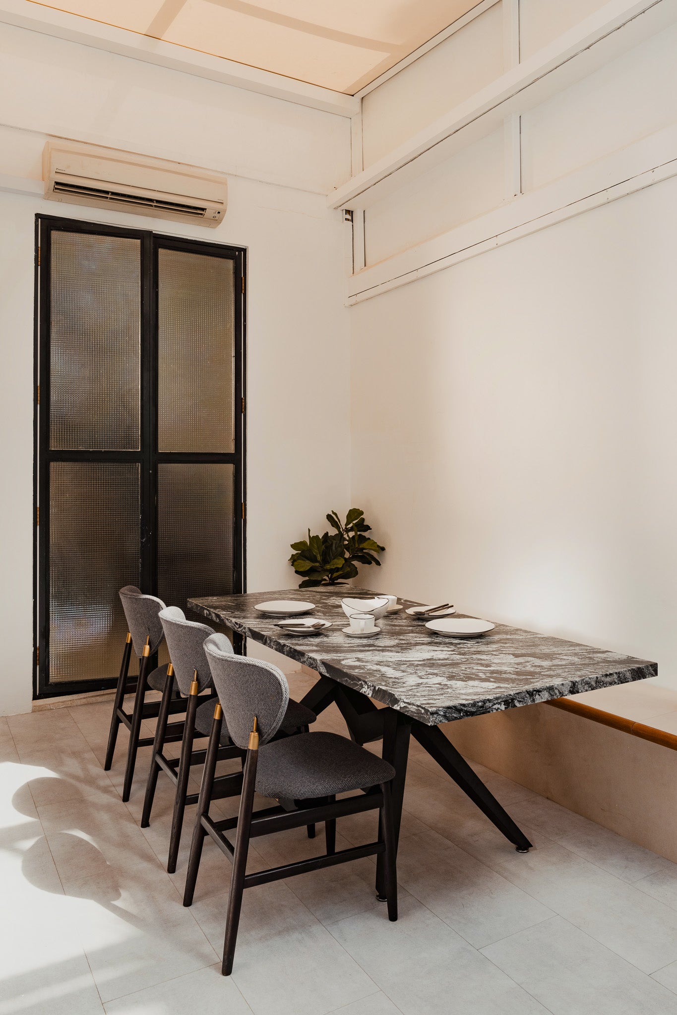 Granite Dining Table in Monocromo Leather by The Table Guy