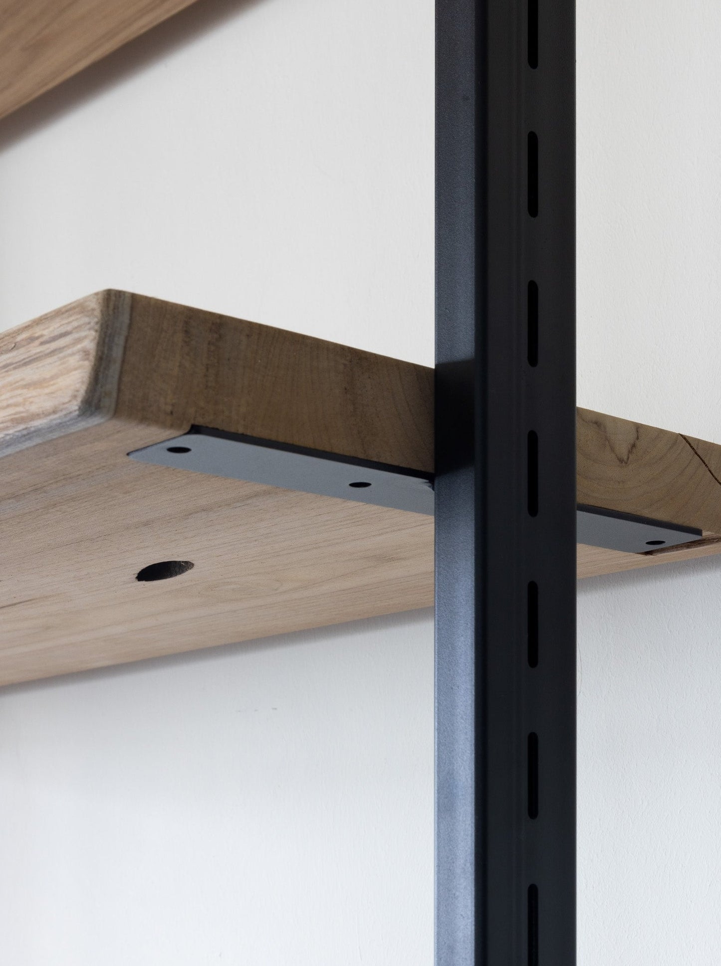 Close up of Adjustable Atlas Shelf System by The Table Guy